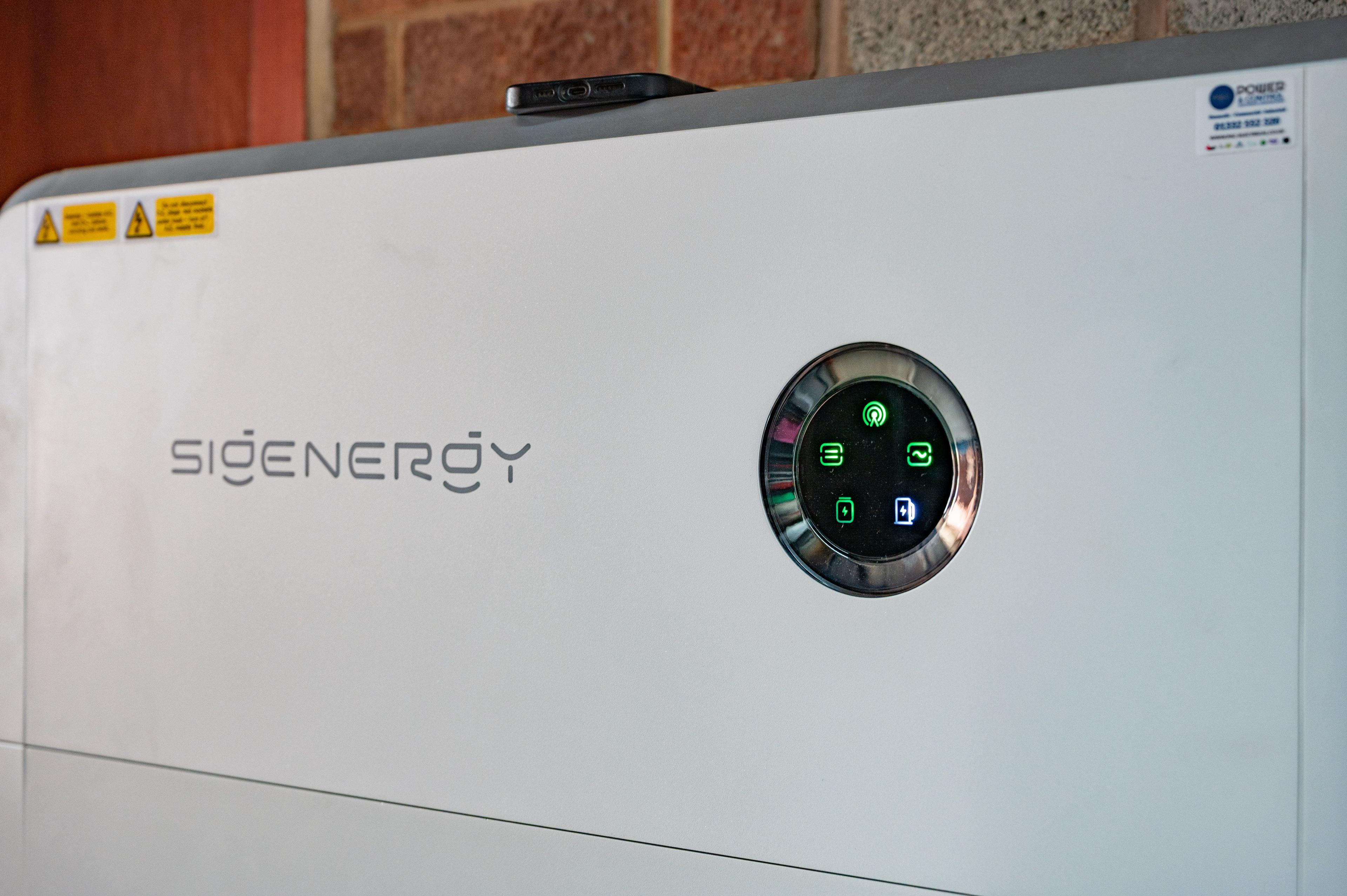 Close-up of the front of a Sigenergy battery unit with its illuminated status display.